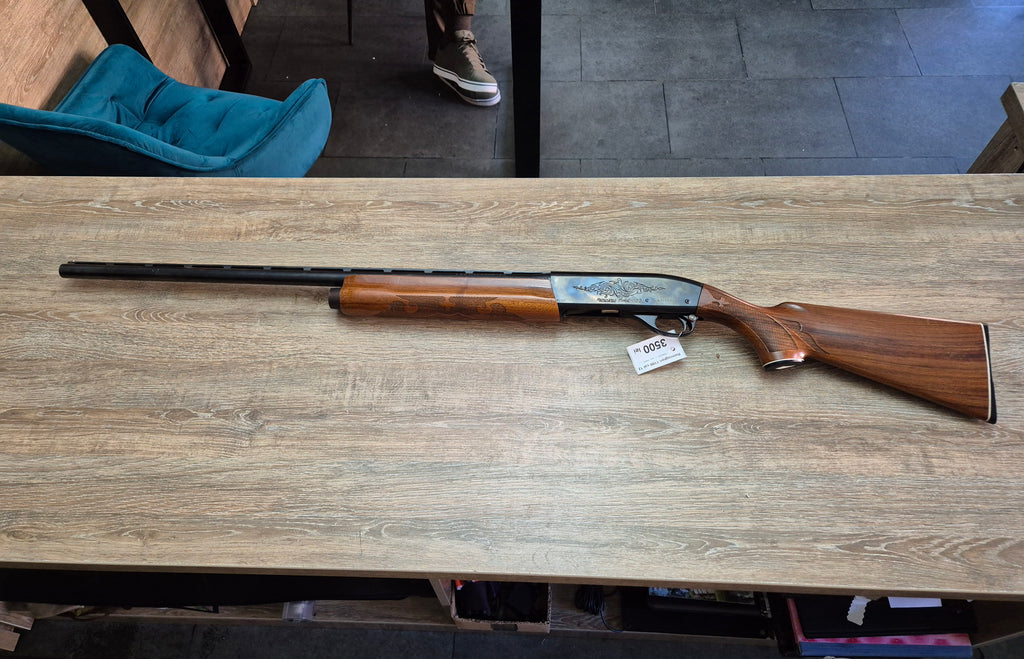 Lisa semiautomata Remington 1100, cal 12, teava 70cm, pat lemn